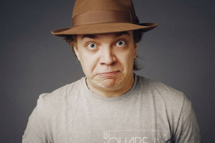 Man with surprised expression wearing a brown hat for funny BF phone moments