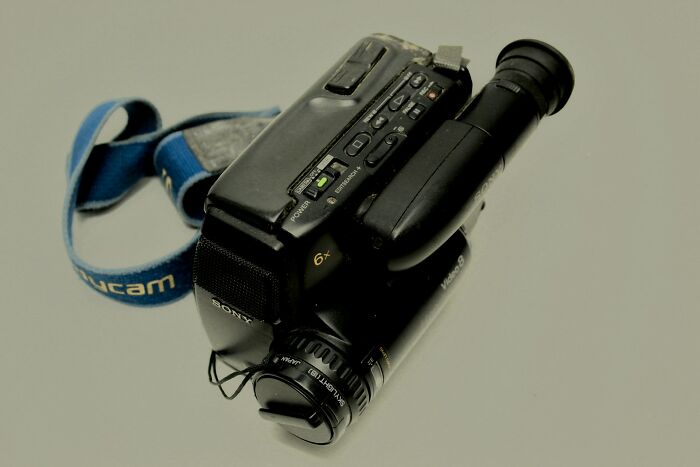 Old Sony camcorder lying on a plain surface