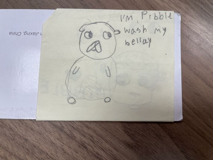 A hand-drawn sketch of a creature with funny text on a sticky note, an example of lost and forgotten messages
