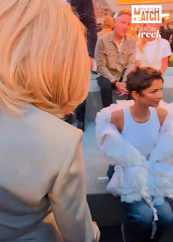Zendaya looks past France's First Lady Brigitte Macron during Paris Fashion Week. Zendaya looks past France's First Lady Brigitte Macron during Paris Fashion Week.