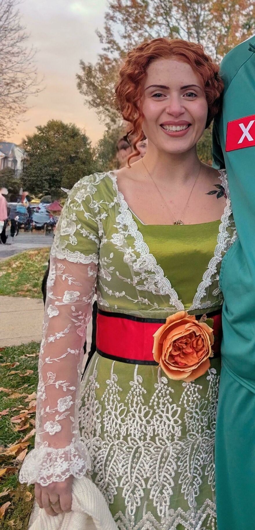 A woman wearing a Rose Dawson Titanic outfit as part of creative Halloween costume ideas.