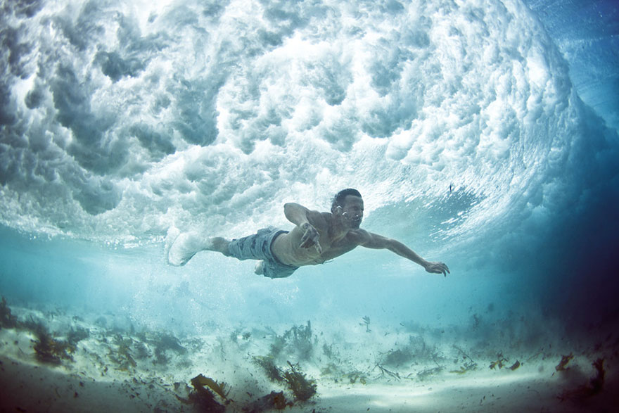 Stunning Underwater Photos of People Fighting Against the Ocean