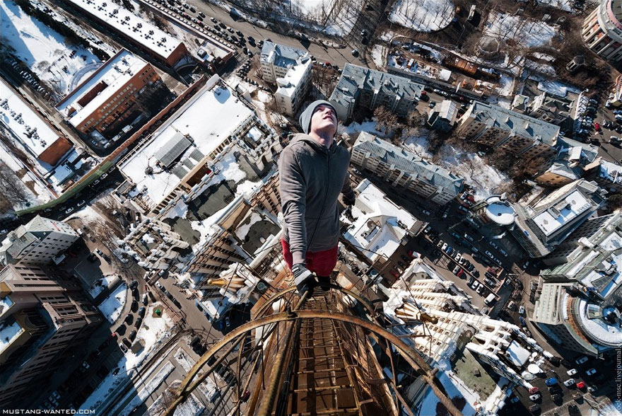 Dizzying Photos of Ukrainian Daredevil Hanging from Tall Buildings