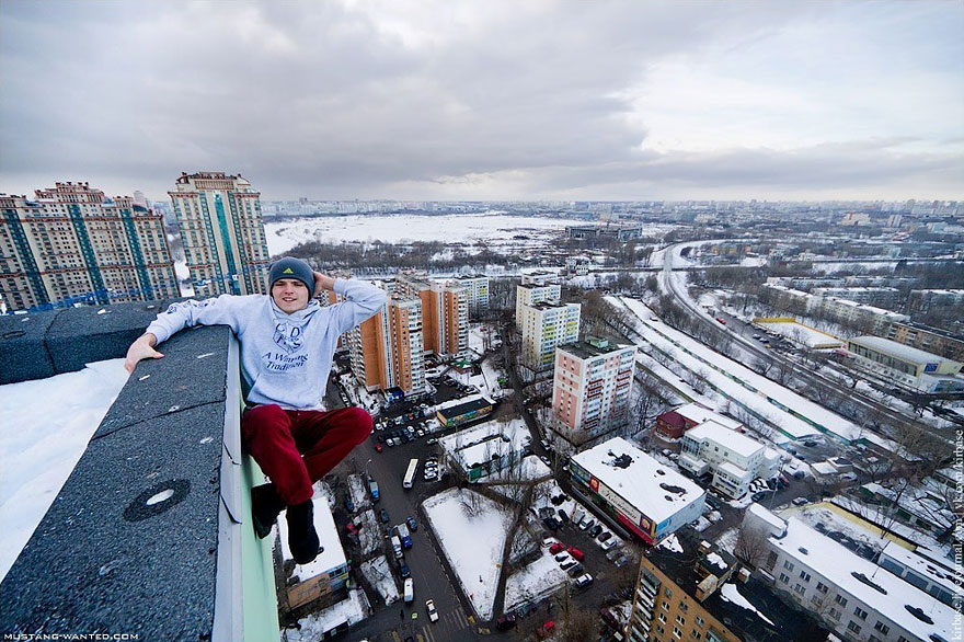Dizzying Photos of Ukrainian Daredevil Hanging from Tall Buildings